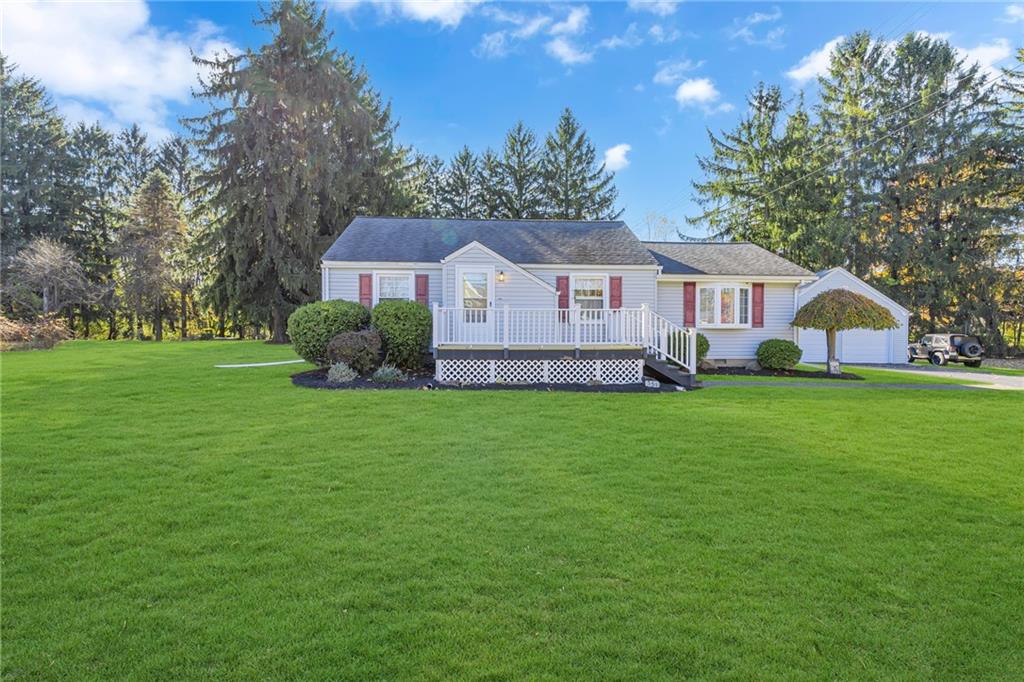 a front view of house with garden