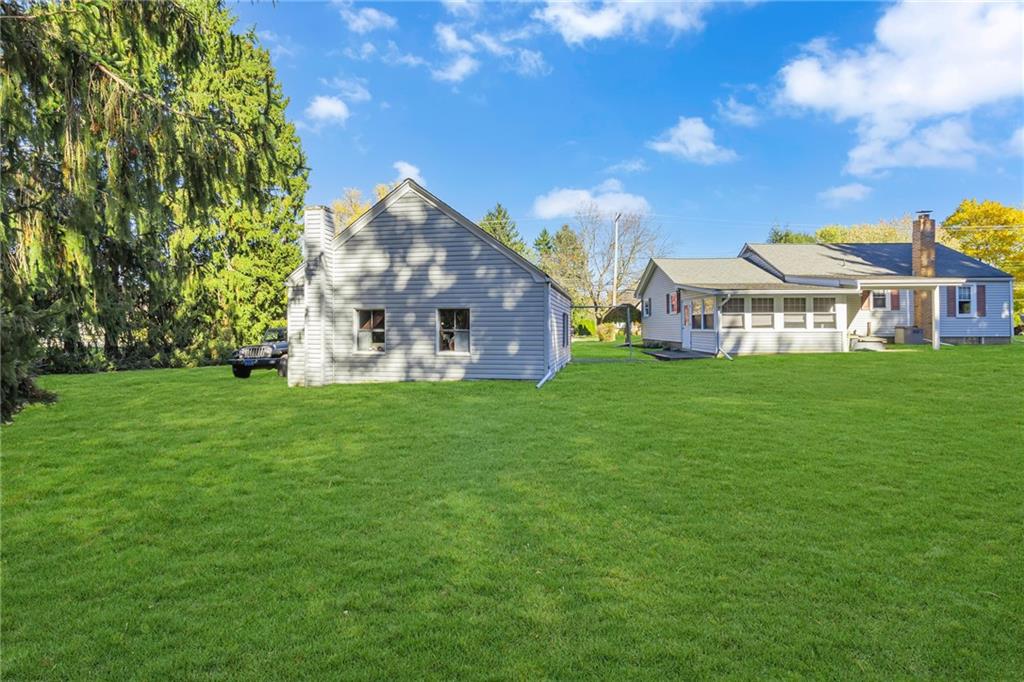 551 Engle Road Industry, PA 15052 - Photo 5 of 23 a view of a house with a big yard and large trees