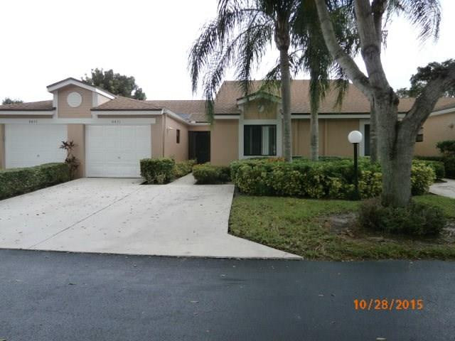 8431 Parkgate Road, Unit 8431 Boca Raton, FL 33496 - Photo 1 of 21 a front view of a house with a garden