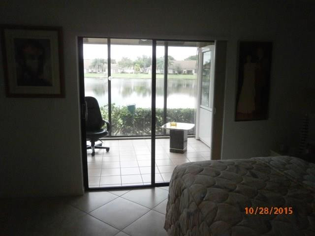 8431 Parkgate Road, Unit 8431 Boca Raton, FL 33496 - Photo 11 of 21 a bedroom with a bed and a window
