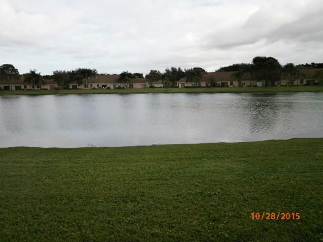8431 Parkgate Road, Unit 8431 Boca Raton, FL 33496 - Photo 3 of 21 a view of a lake with houses in the back