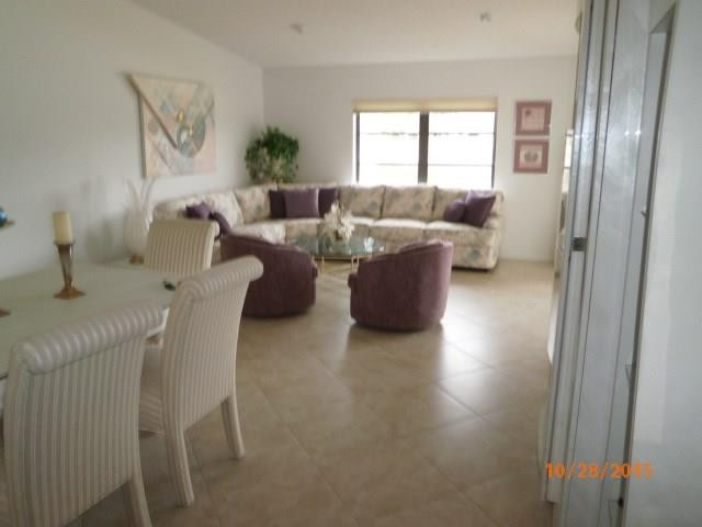 8431 Parkgate Road, Unit 8431 Boca Raton, FL 33496 - Photo 8 of 21 a living room with furniture two window and a potted plant