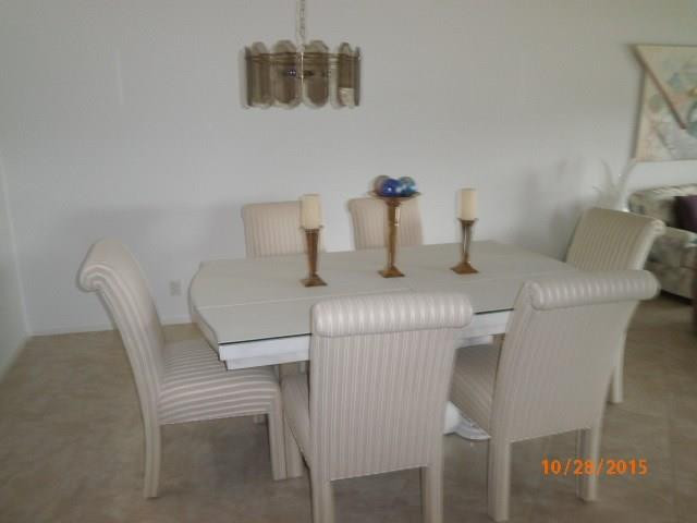 8431 Parkgate Road, Unit 8431 Boca Raton, FL 33496 - Photo 9 of 21 a dining room with furniture and window