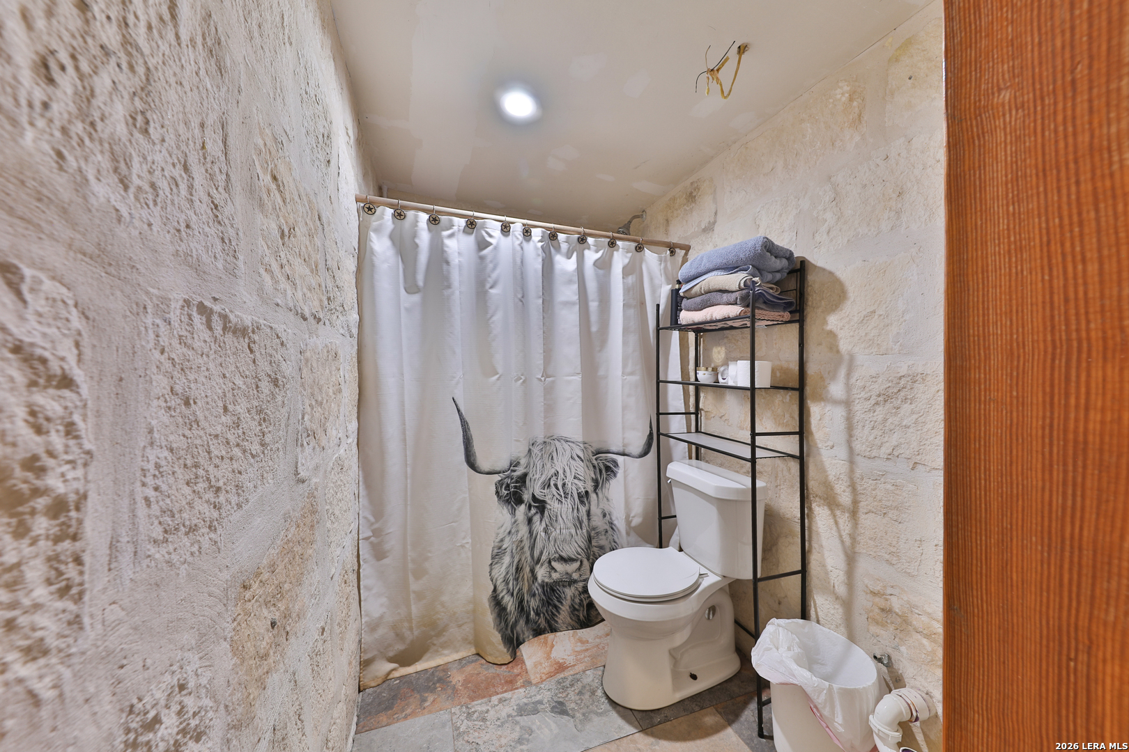 122 Brink Center Point, TX 78010 - Photo 16 of 40 a bathroom with a toilet and a shower