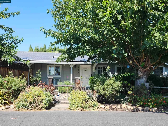 front view of a house with a small yard