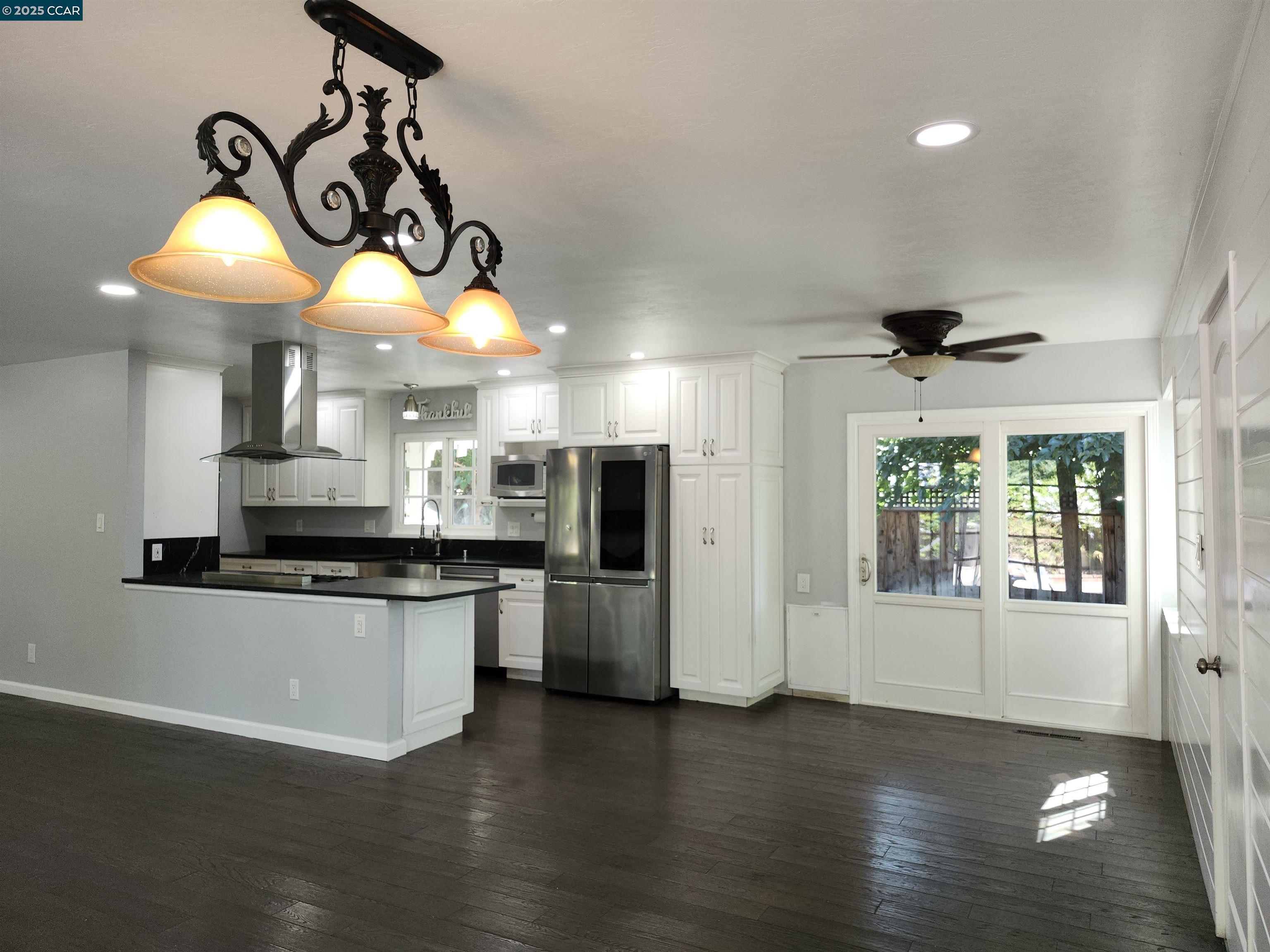 3479 Rose Court Concord, CA 94519 - Photo 14 of 60 a kitchen with stainless steel appliances granite countertop a stove a refrigerator a oven and a wooden floor