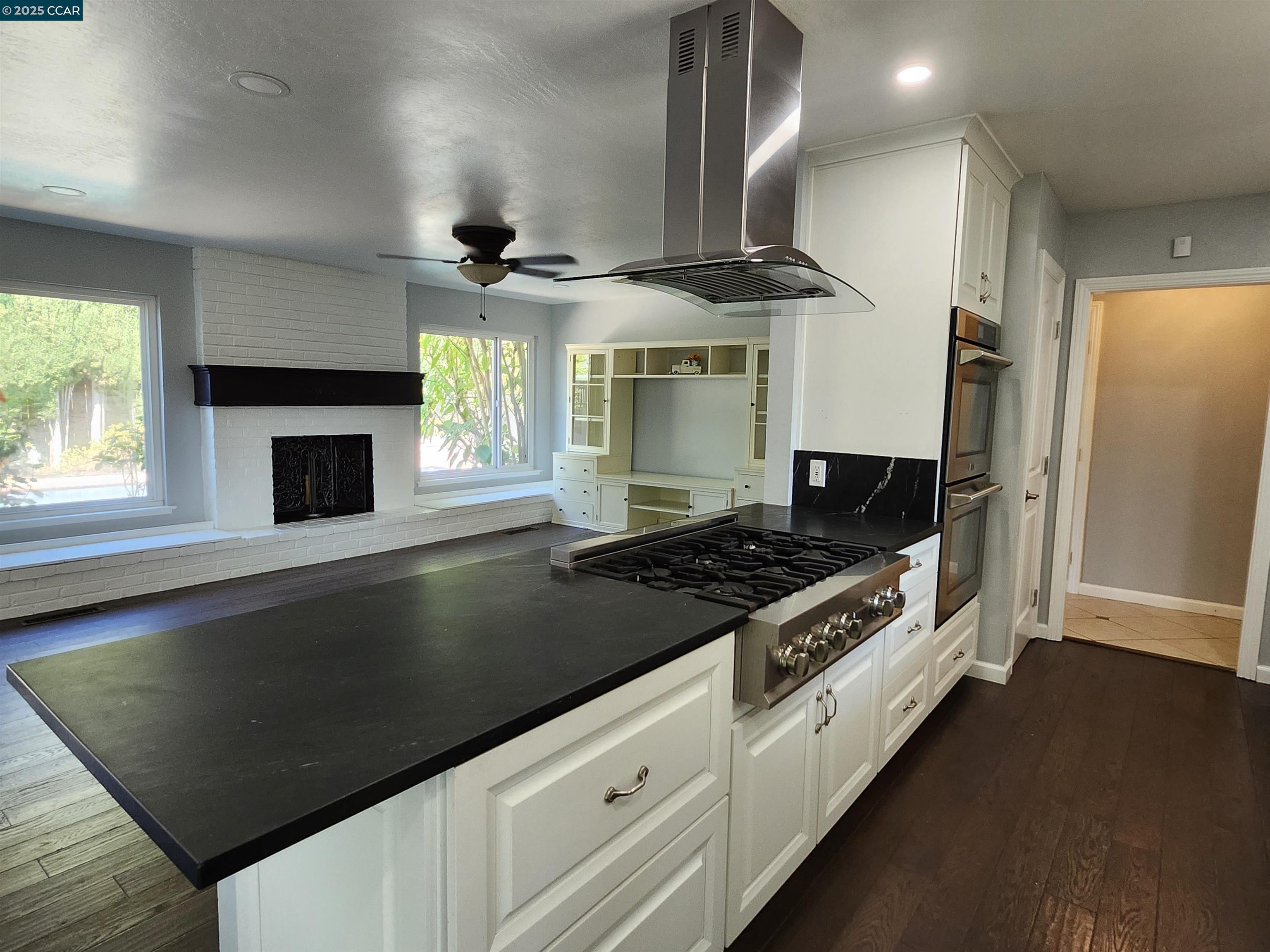 3479 Rose Court Concord, CA 94519 - Photo 17 of 60 a kitchen with granite countertop a stove and a refrigerator