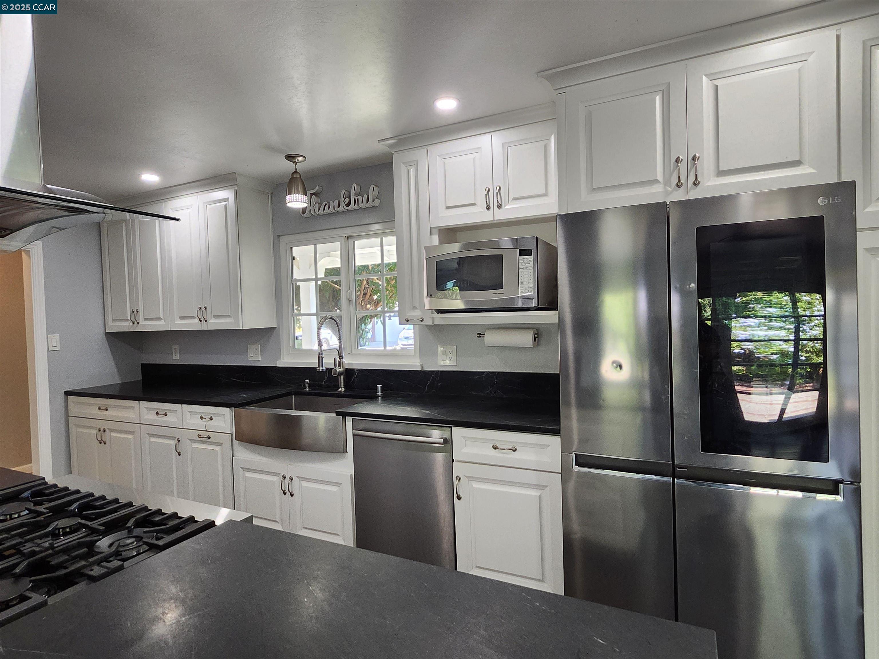 3479 Rose Court Concord, CA 94519 - Photo 18 of 60 a kitchen with stainless steel appliances granite countertop a refrigerator a stove a sink and a microwave