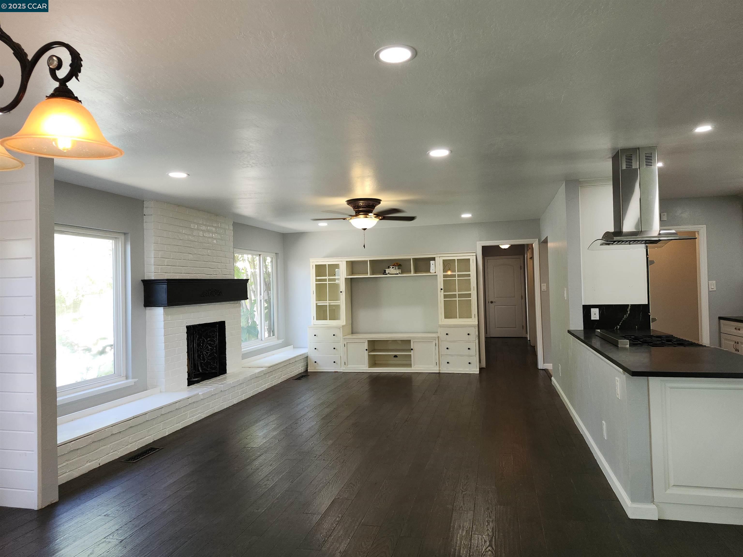 3479 Rose Court Concord, CA 94519 - Photo 19 of 60 a view of a kitchen with a sink a fireplace and a window