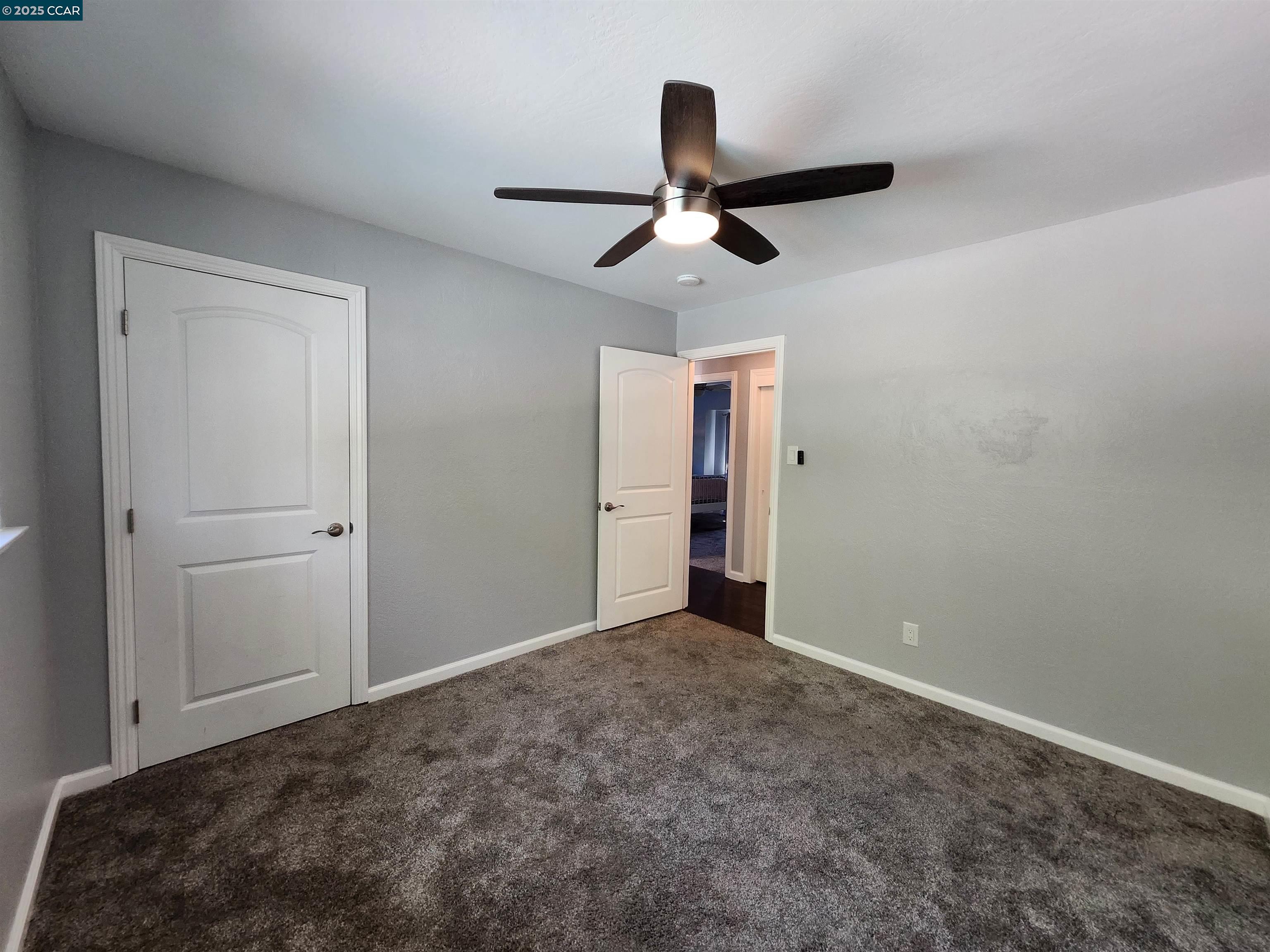 3479 Rose Court Concord, CA 94519 - Photo 26 of 60 a view of a livingroom with a ceiling fan and entryway