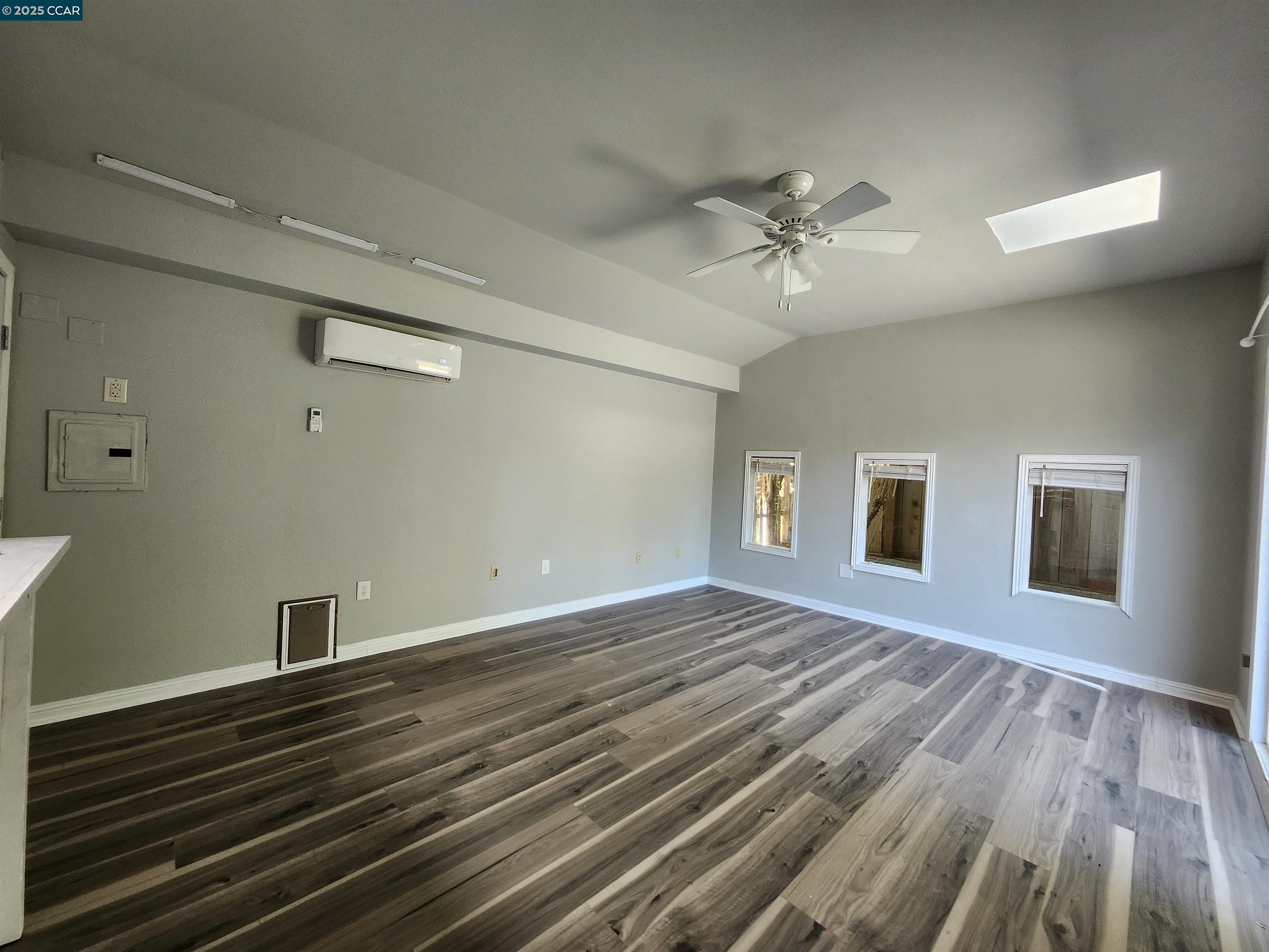 3479 Rose Court Concord, CA 94519 - Photo 43 of 60 a view of an empty room with window and wooden floor