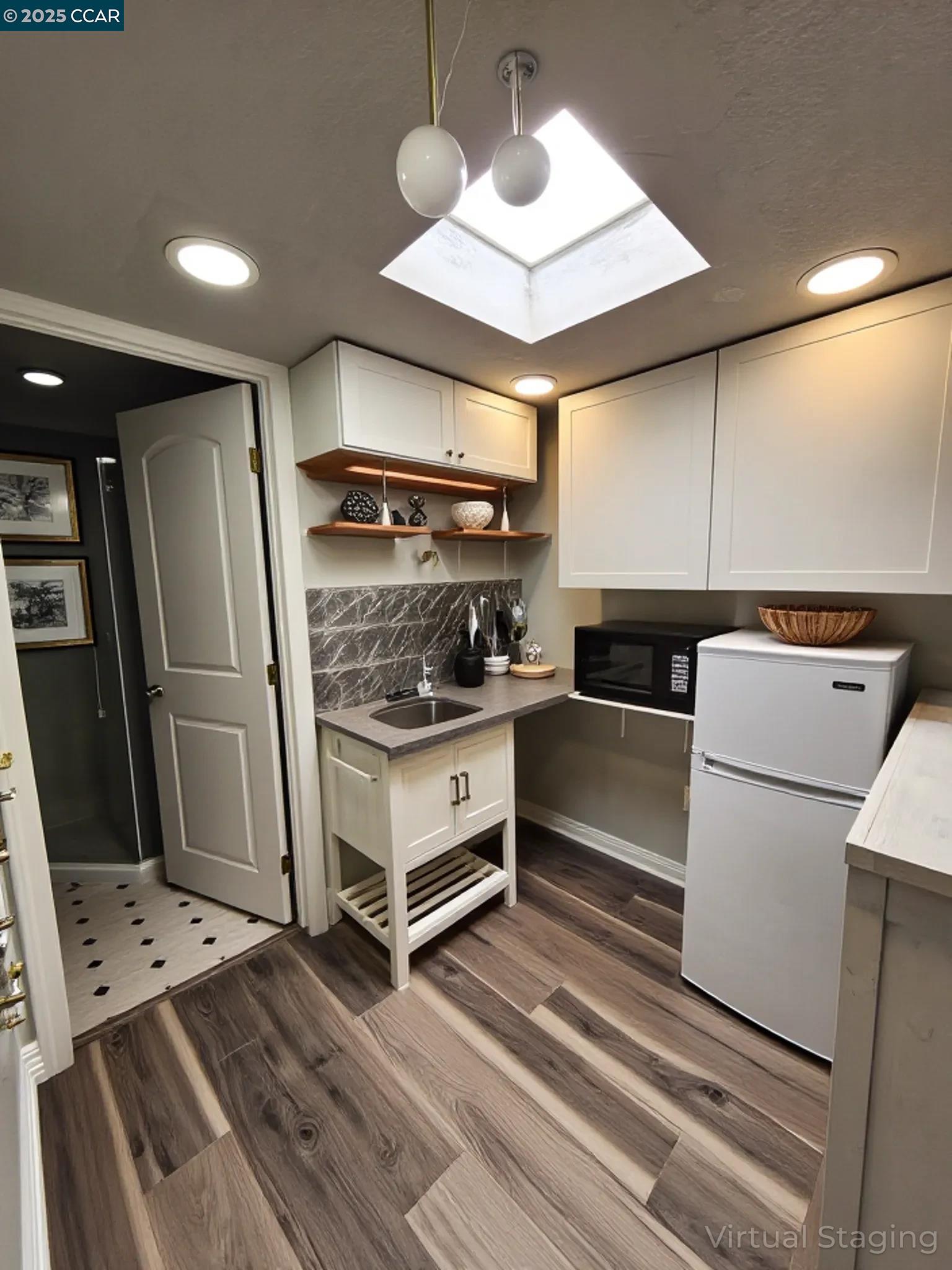 3479 Rose Court Concord, CA 94519 - Photo 48 of 60 a kitchen with a refrigerator and white cabinets