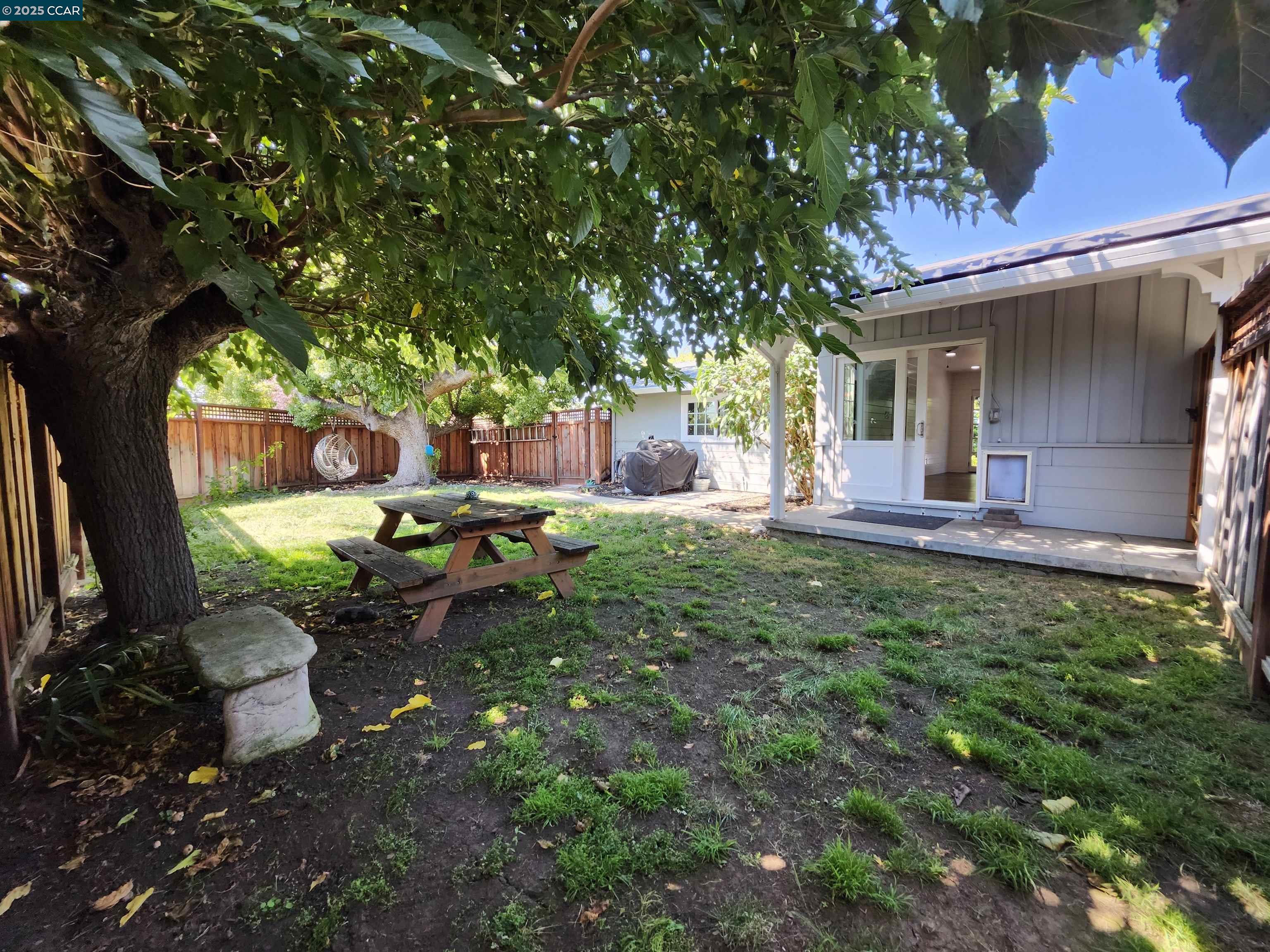 3479 Rose Court Concord, CA 94519 - Photo 55 of 60 a backyard of a house with table and chairs a barbeque with a large tree