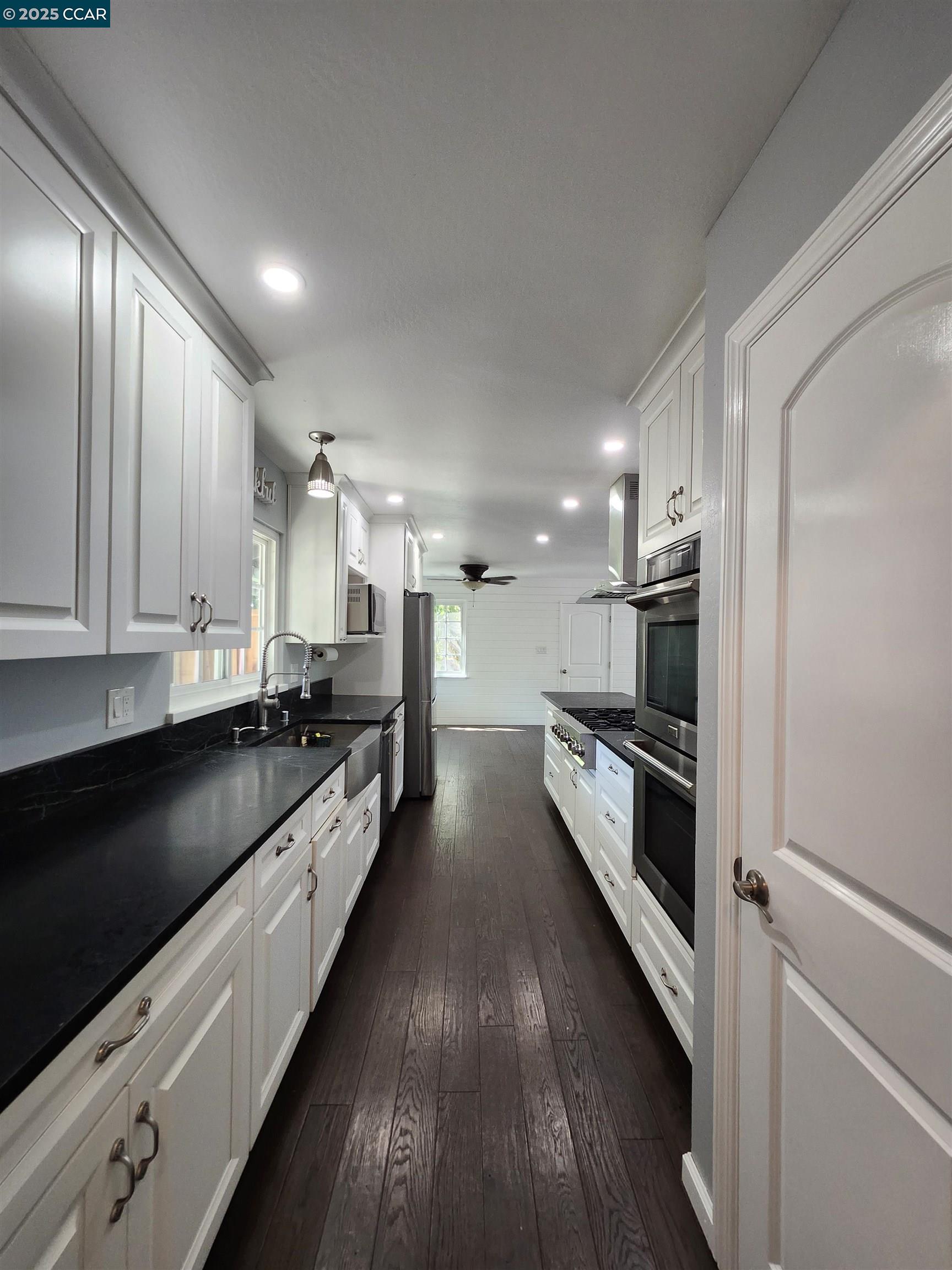 3479 Rose Court Concord, CA 94519 - Photo 10 of 60 a large kitchen with stainless steel appliances and a stove