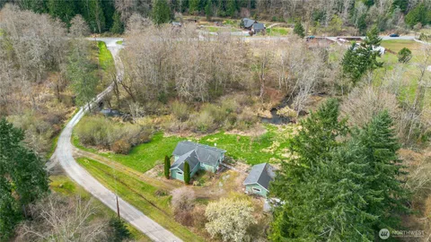 a view of a lake with a yard