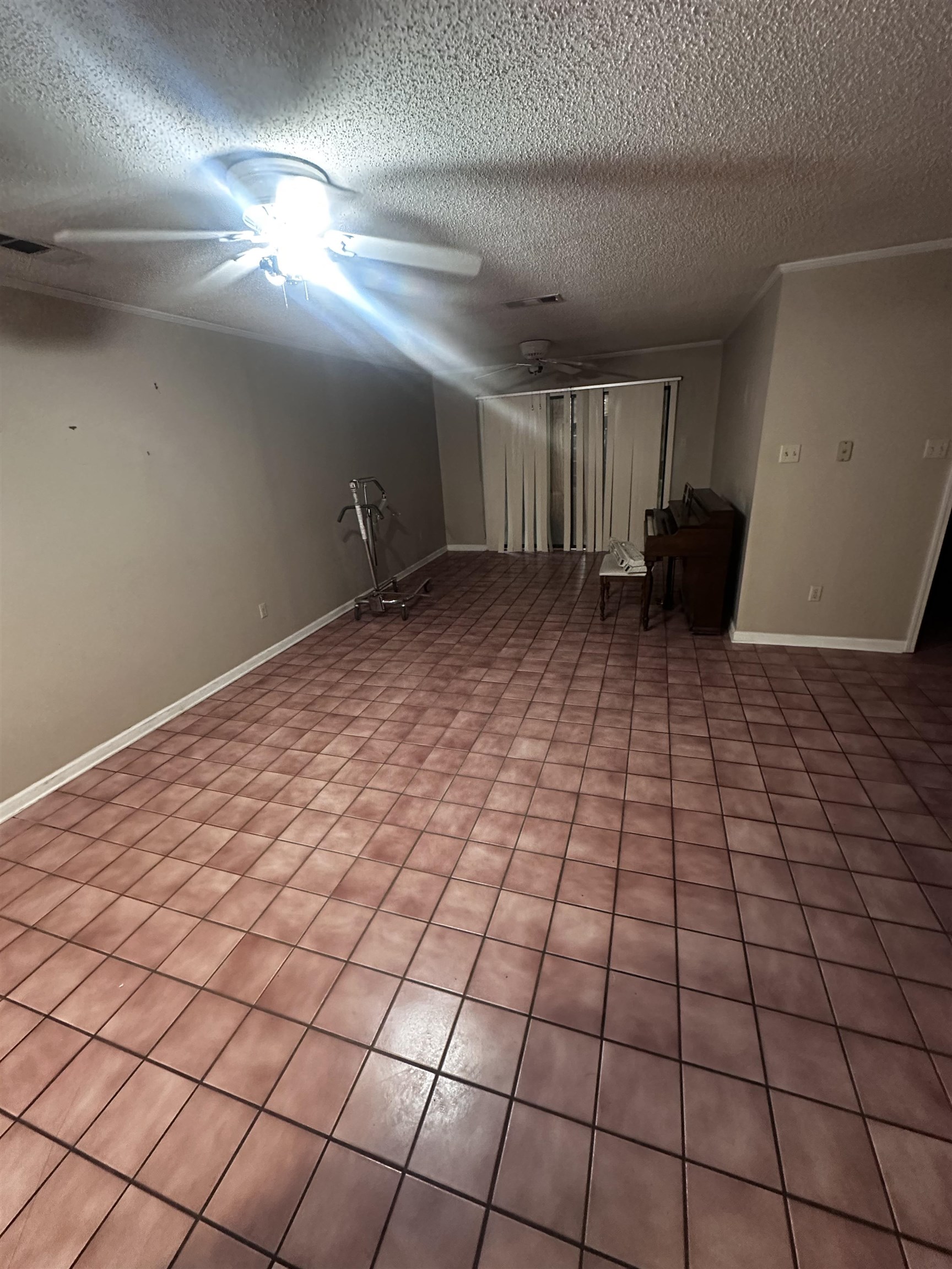 1865 Bartlett Road Memphis, TN 38134 - Photo 3 of 26 a view of a livingroom with an empty space and a window