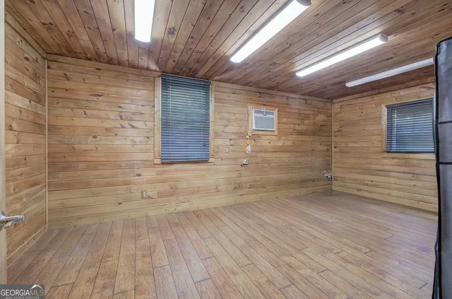 a view of room with a ceiling fan and window