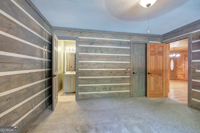 a bathroom with a toilet a sink and a mirror