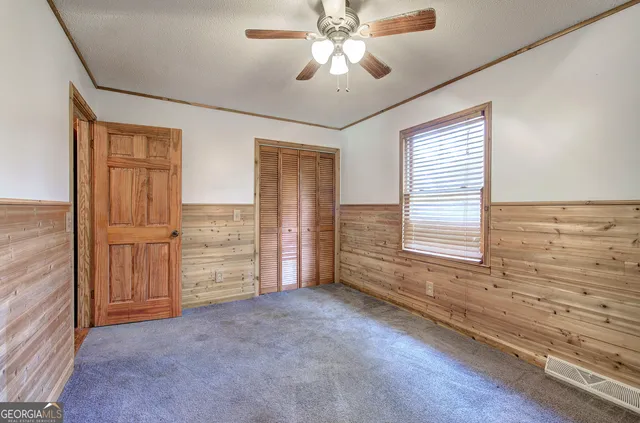 a bathroom with a sink toilet double vanity and shower
