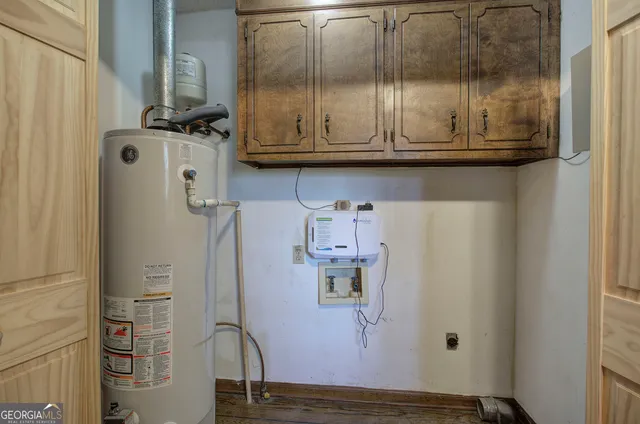 a view of a hallway with wooden floor and entryway