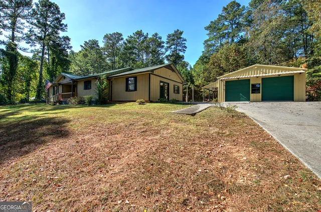 a big house with large trees and a big yard