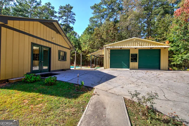 a view of a house with trees in the background