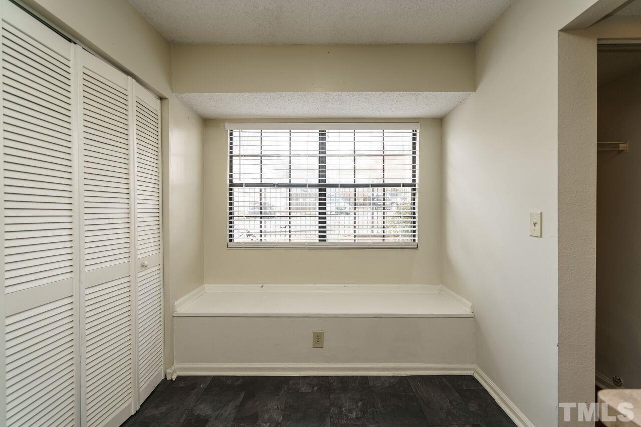 7906 Falcon Rest Circle Raleigh, NC 27615 - Photo 12 of 20 a bathroom with a bathtub and next to a window