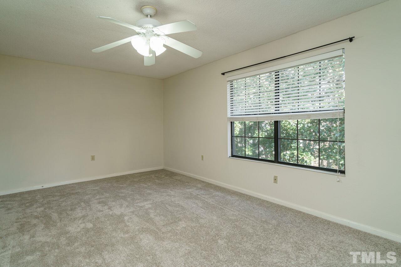 7906 Falcon Rest Circle Raleigh, NC 27615 - Photo 13 of 20 a view of an empty room with a window
