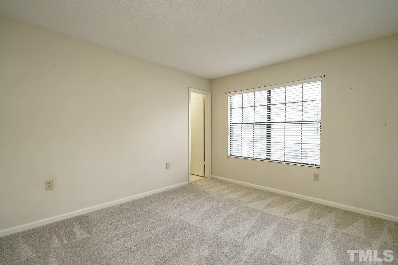 7906 Falcon Rest Circle Raleigh, NC 27615 - Photo 15 of 20 a view of an empty room with a window