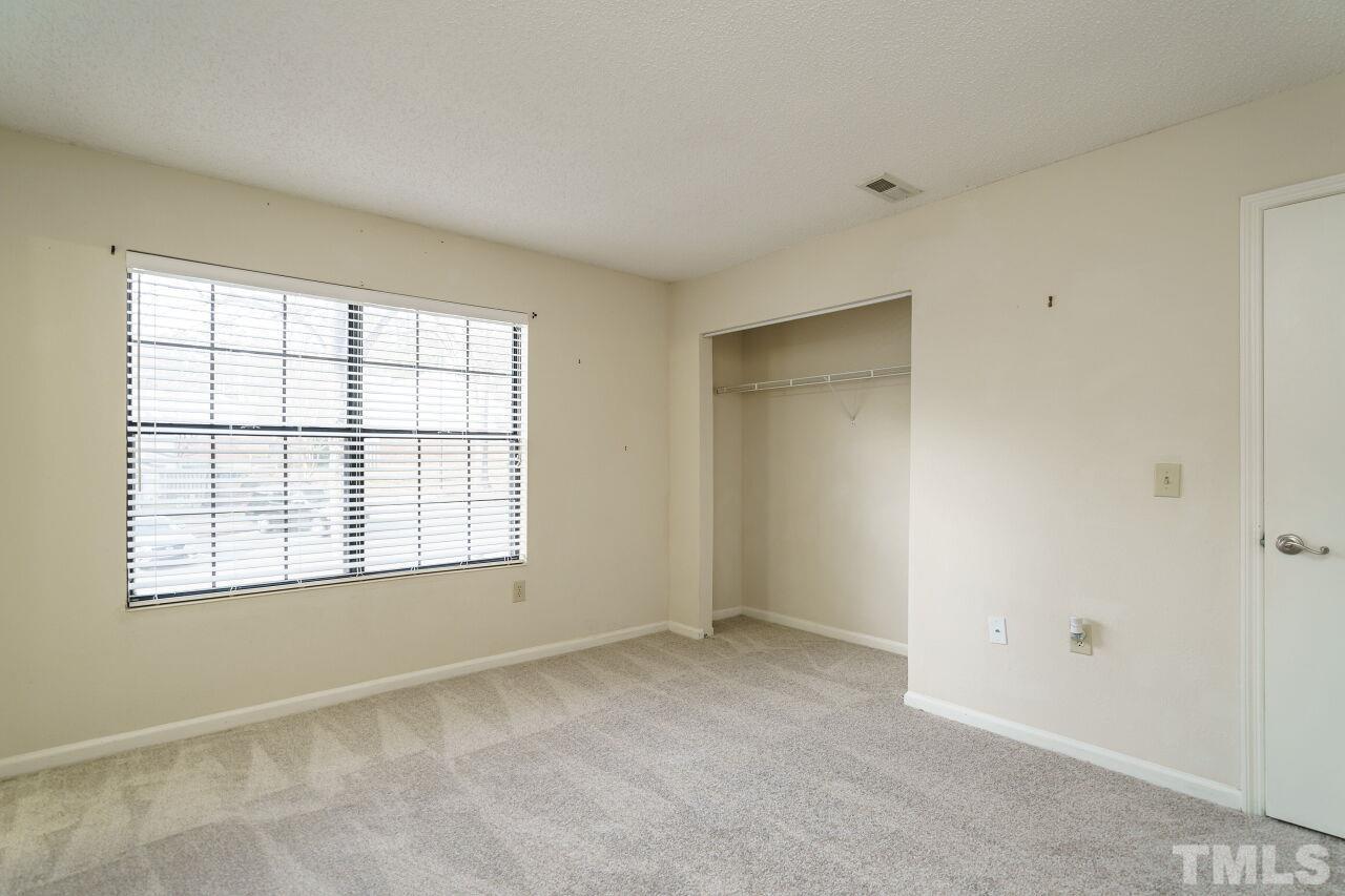 7906 Falcon Rest Circle Raleigh, NC 27615 - Photo 16 of 20 an empty room with a window