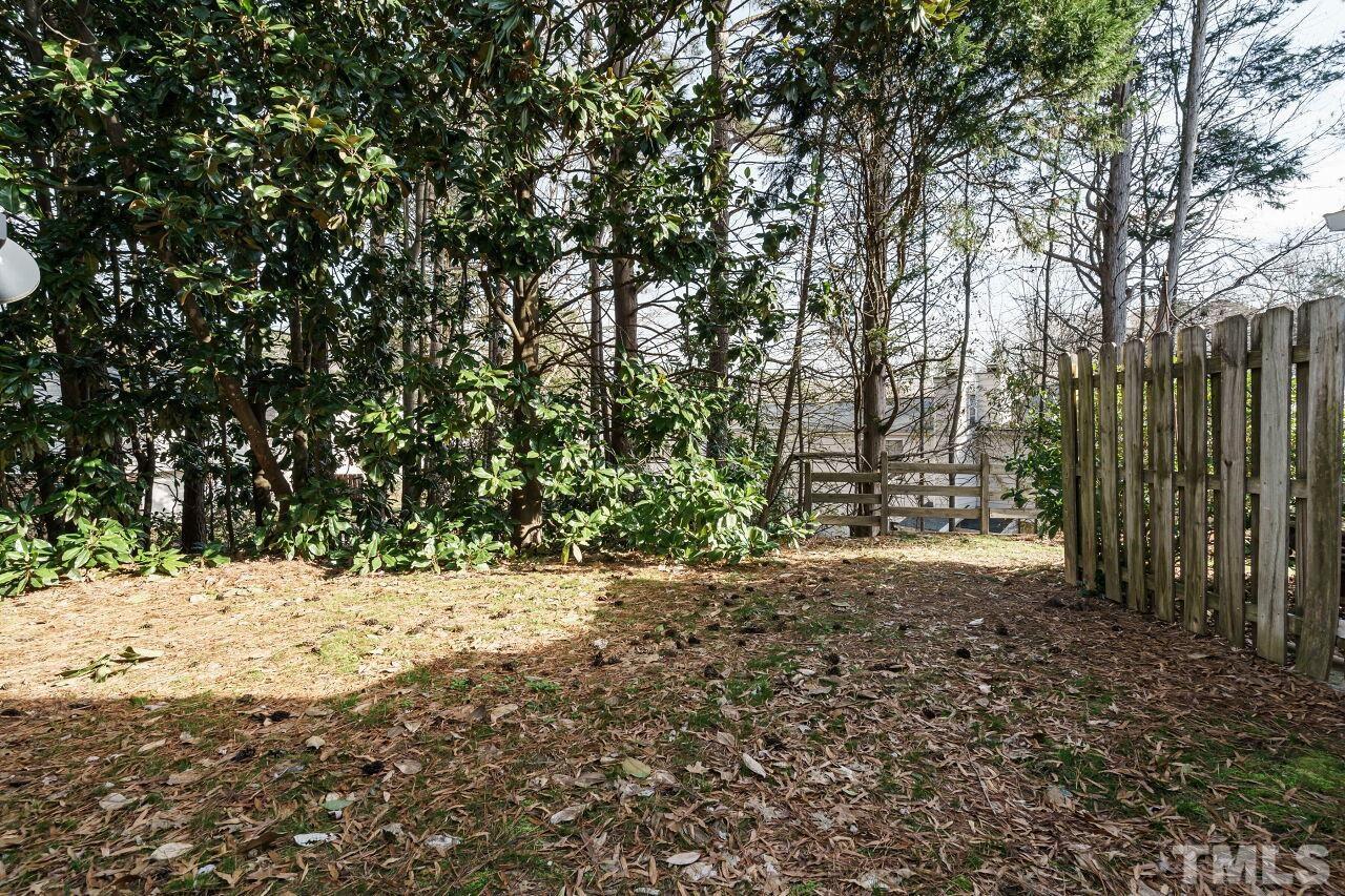 7906 Falcon Rest Circle Raleigh, NC 27615 - Photo 19 of 20 a view of a yard covered in snow
