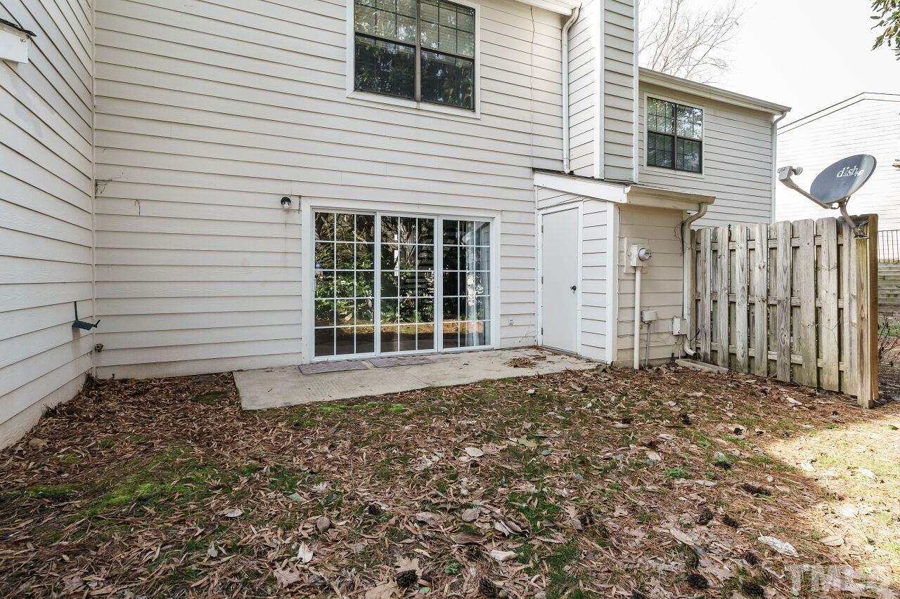 7906 Falcon Rest Circle Raleigh, NC 27615 - Photo 20 of 20 a front view of a house with a garden