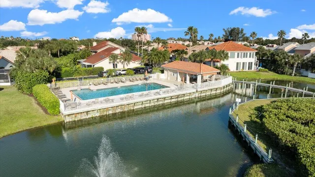 an aerial view of a house a yard and outdoor seating
