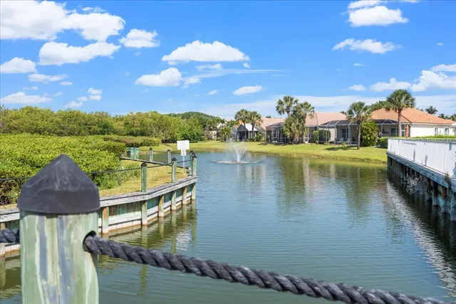a view of a pathway with a garden