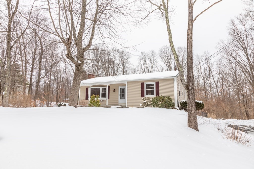32 Paradise Lake Road Monson, MA 01057 - Photo 1 of 35 a front view of house with yard covered in snow