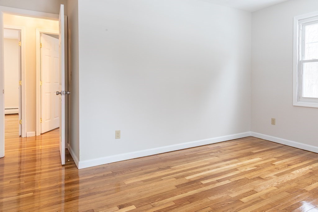 32 Paradise Lake Road Monson, MA 01057 - Photo 23 of 35 a view of an empty room with wooden floor and a window