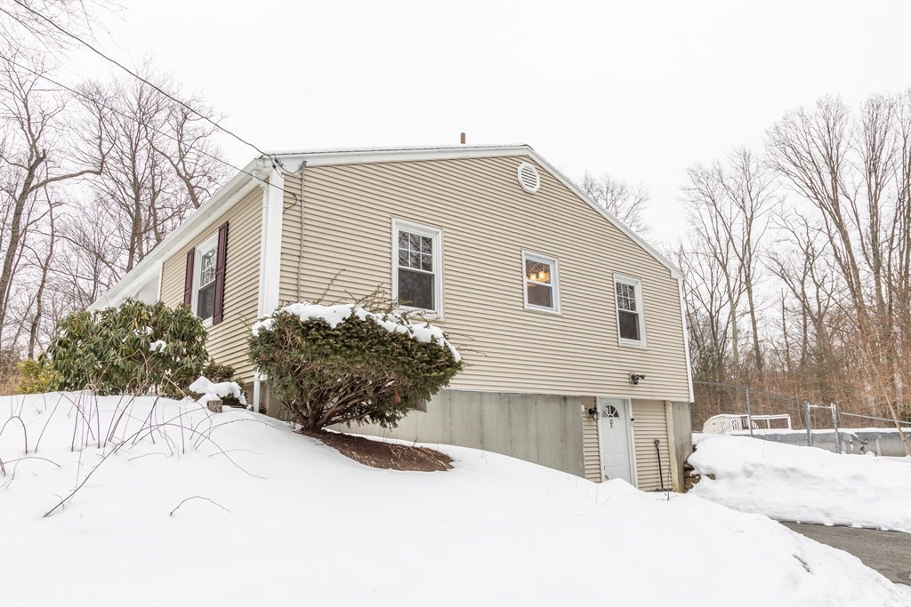 32 Paradise Lake Road Monson, MA 01057 - Photo 3 of 35 a view of a house covered in snow