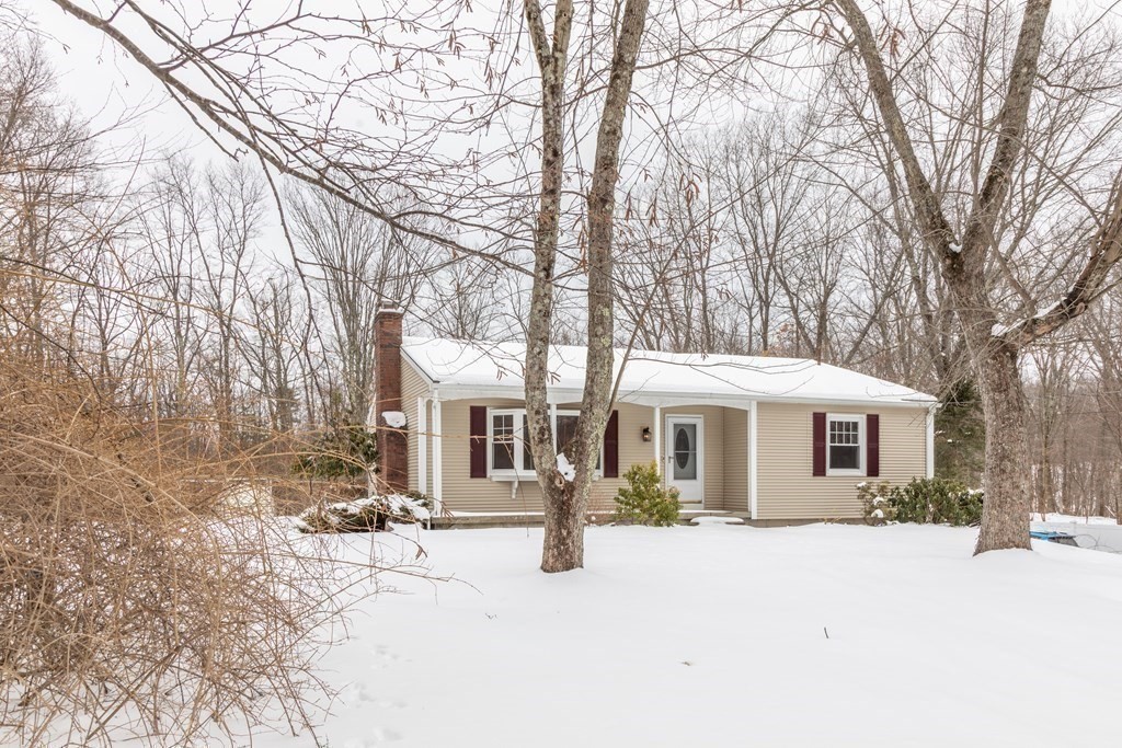 32 Paradise Lake Road Monson, MA 01057 - Photo 5 of 35 a front view of a house with a yard