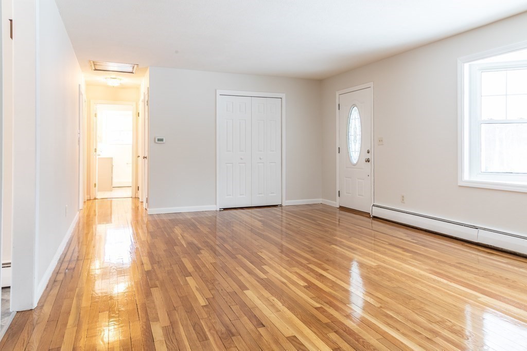 32 Paradise Lake Road Monson, MA 01057 - Photo 9 of 35 a view of empty room with wooden floor and fan