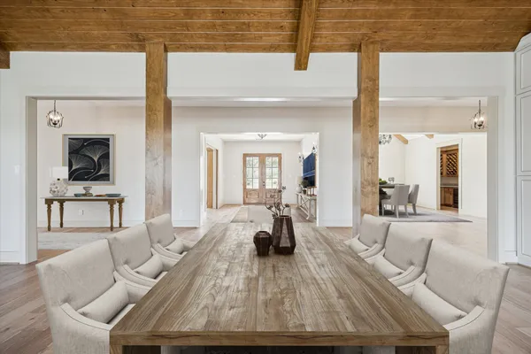 a kitchen with granite countertop a stove a sink and a refrigerator