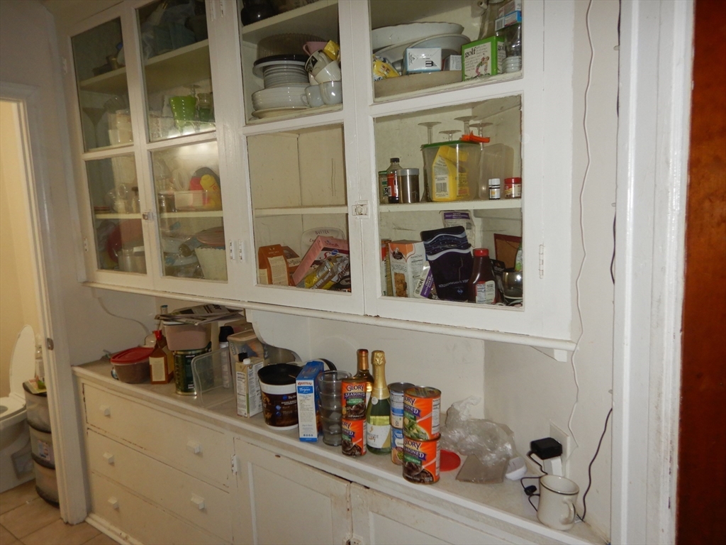 288 St James Avenue Springfield, MA 01109 - Photo 11 of 34 a shelf with books and knick knacks on it
