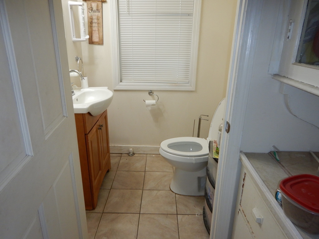 288 St James Avenue Springfield, MA 01109 - Photo 12 of 34 a bathroom with a sink and a toilet