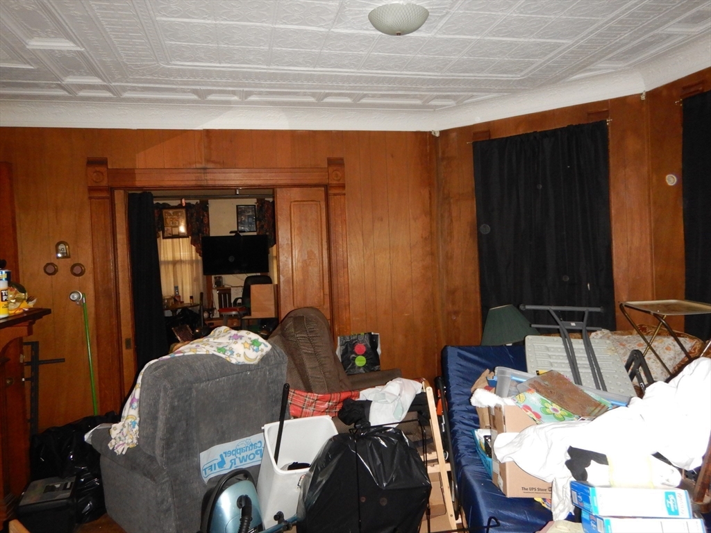 288 St James Avenue Springfield, MA 01109 - Photo 15 of 34 a bed room with a bed and a chair