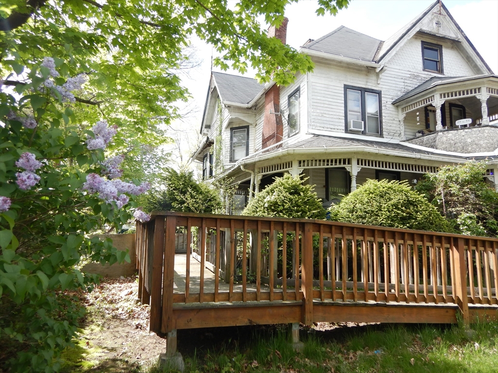 288 St James Avenue Springfield, MA 01109 - Photo 2 of 34 a view of wooden house with a yard