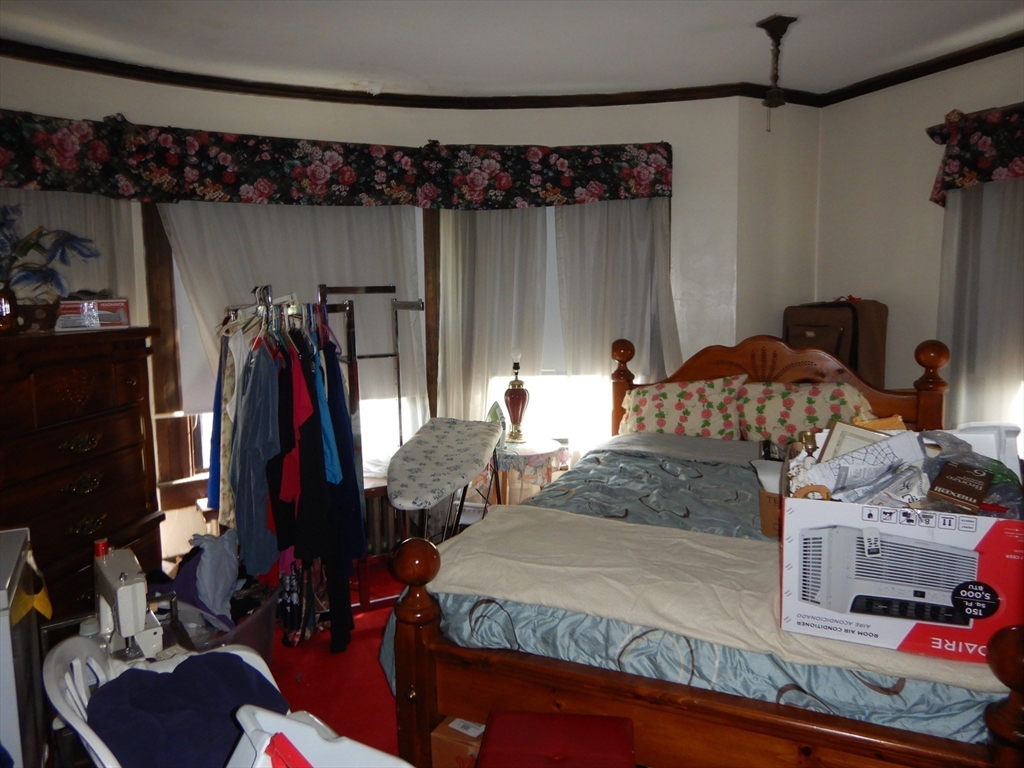 288 St James Avenue Springfield, MA 01109 - Photo 22 of 34 a bedroom with a bed and a mirror