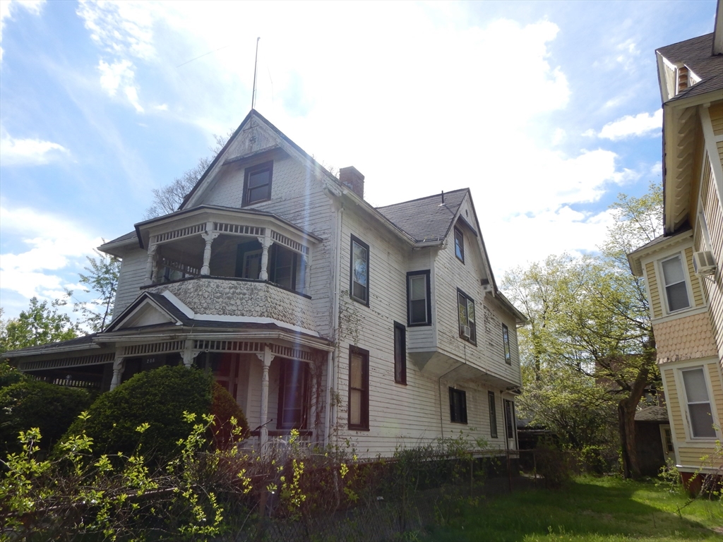 288 St James Avenue Springfield, MA 01109 - Photo 3 of 34 a front view of a house with garden