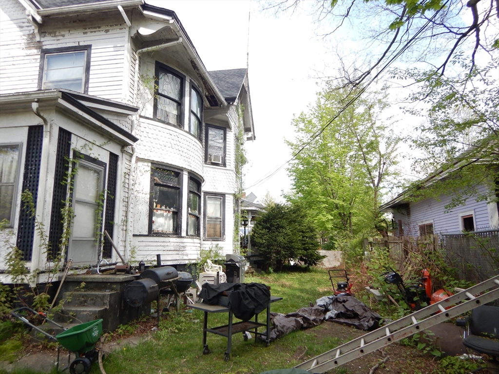 288 St James Avenue Springfield, MA 01109 - Photo 4 of 34 a view of a house with backyard porch and sitting area