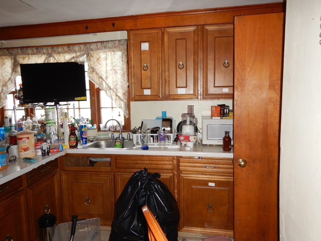 288 St James Avenue Springfield, MA 01109 - Photo 8 of 34 a kitchen with a refrigerator and a stove top oven