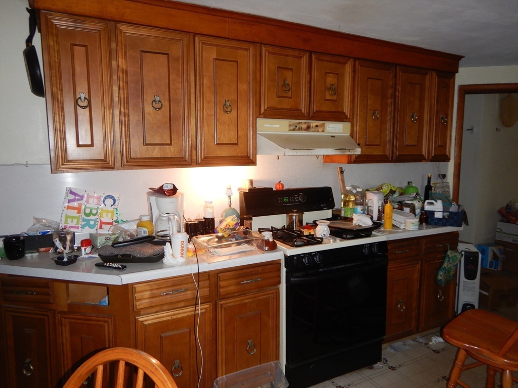 288 St James Avenue Springfield, MA 01109 - Photo 9 of 34 a kitchen with a sink cabinets and window