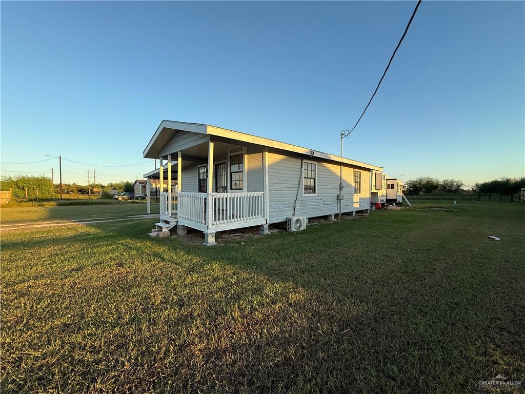 233 Buena Tierra Street Donna, TX 78537 - Photo 3 of 11 a view of a house with a yard